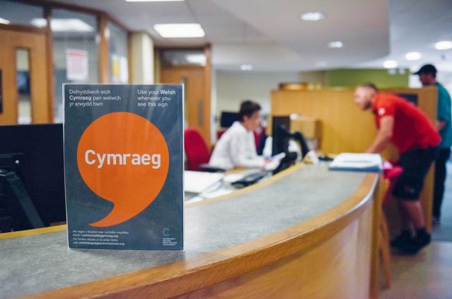 Iaith Gwaith poster on desk