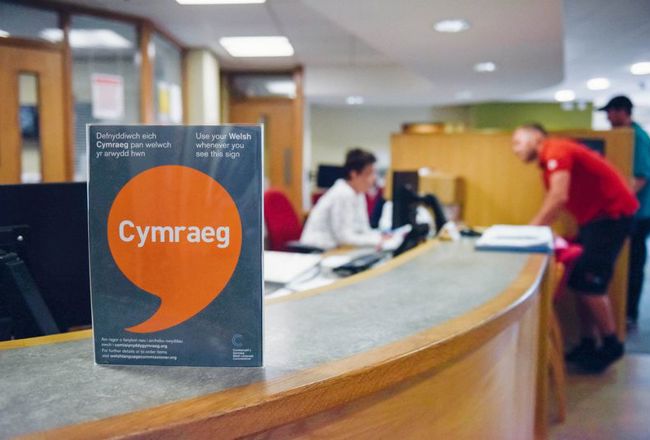 Iaith Gwaith poster on reception desk