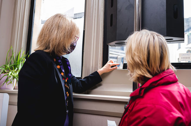 Customer asking bank worker for help 