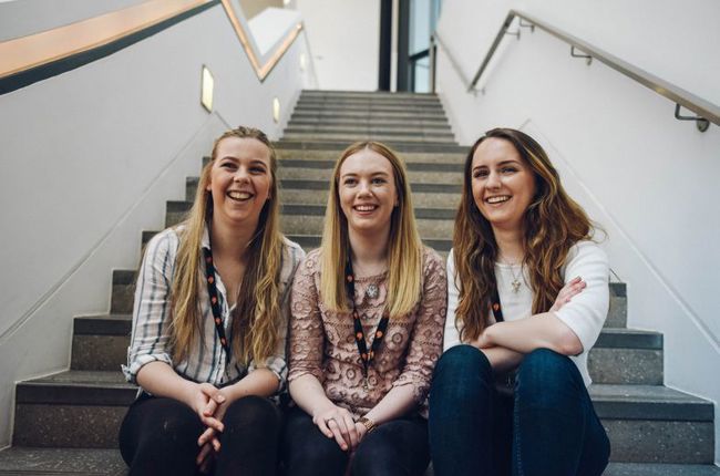 Photos of three young women sitting on stairs