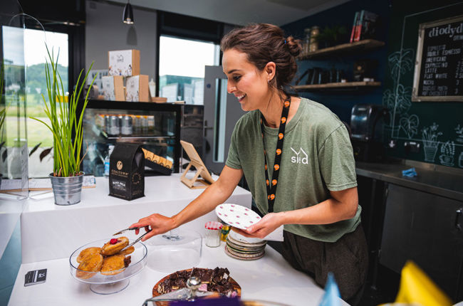 Woman serving cakes